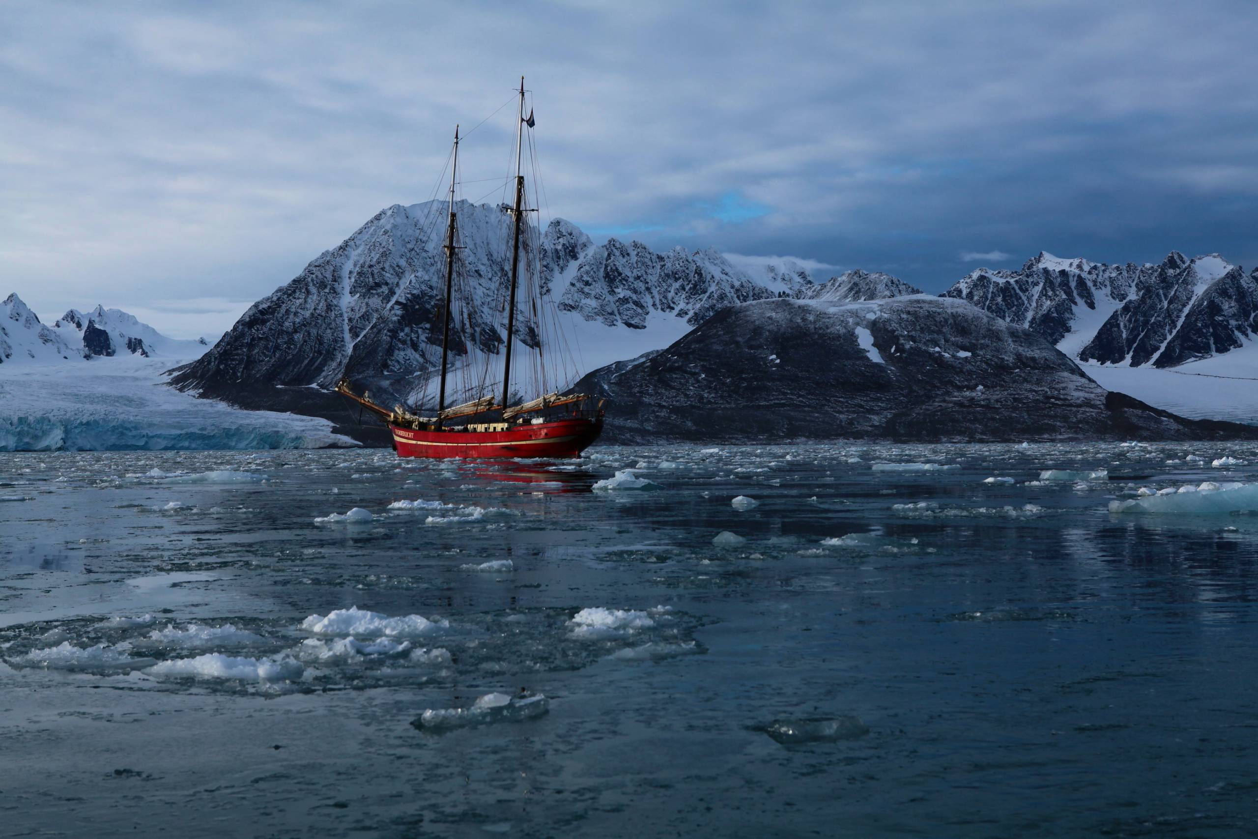 sailing boat moored in an arctic inlet