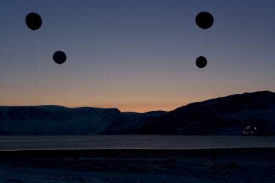 weather balloons in an Arctic landscape